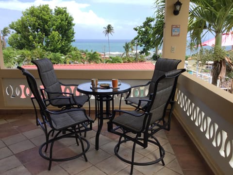 Second story veranda corner table overlooking the Caribbean Sea.