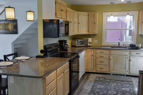 Nicely appointed kitchen with the basics. Coffee/tea provided, but BYO food.