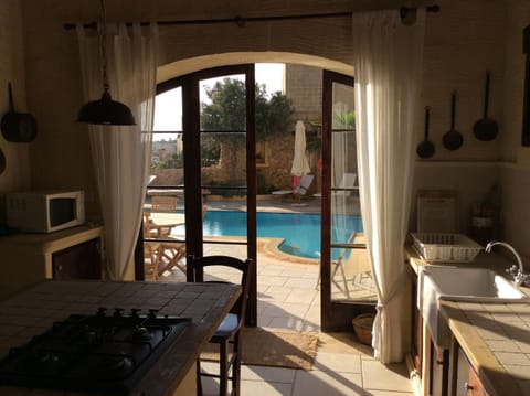 Kitchen stepout onto pool area - Tal-Bjar Villa Gozo