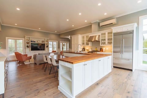 Gourmet Kitchen & Dining Experience: Our kitchen is a chef's delight, equipped with high-end Jenn-Air appliances that cater to all your culinary needs. The spacious layout features ample white cabinetry for storage, sleek countertops for meal prep, p