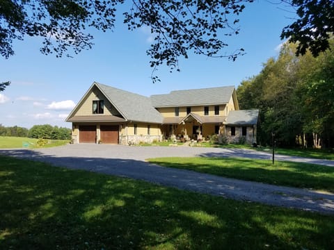 The Suite parking is to the left of the house beyond the garage