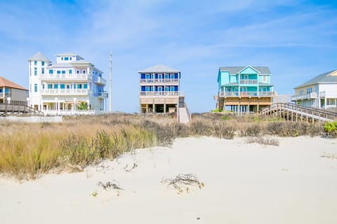 Standing near water edge. You will love our sand out on the beach!