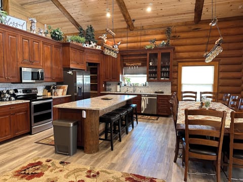 Large Kitchen, open pantry and all the conveniences needed. Seating for 16.