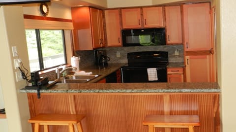 Side 1 FULL Kitchen with all new appliances, over-looking the Tree Tops.