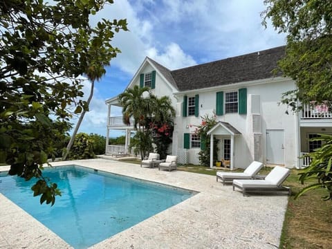 Buccaneer Hill sits high on a hilltop overlooking Governors Harbour and the Caribbean Sea beyond.