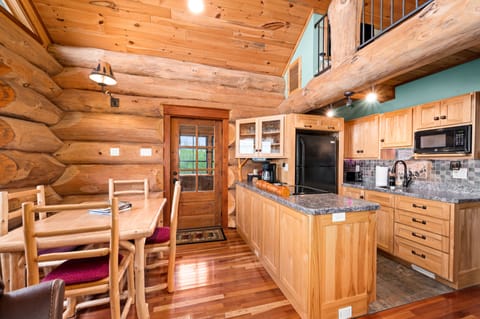 Kitchen and dining area. Table seats 4 people.