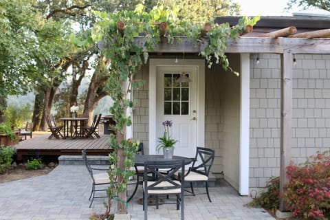 Large outdoor private garden with deck, grill, hot tub and views.