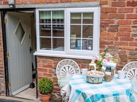 Sitting-out-area | Ashton Court Holiday Cottages - East Granary, Ashton, nr. Leominster