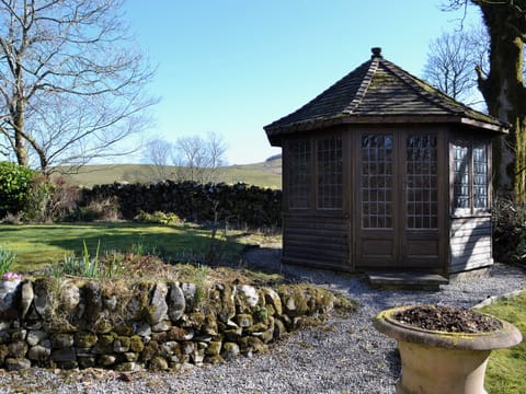 The garden has a summerhouse | Arkland Mill - Crofts Cottages, Near Castle Douglas