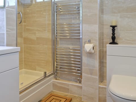 Fully tiled shower room with modern chrome radiator | Sheerwater, Appledore