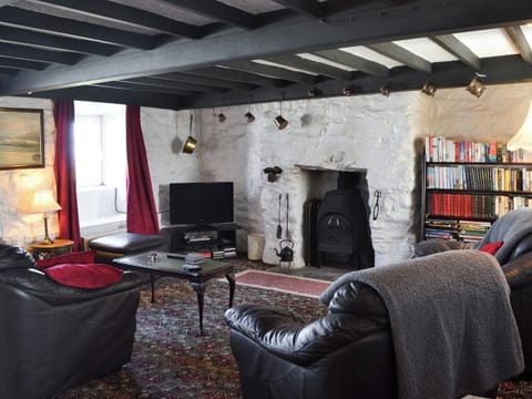 Living room with wood burner | Porth Colmon Farmhouse, Porth Colmon, near Pwllheli