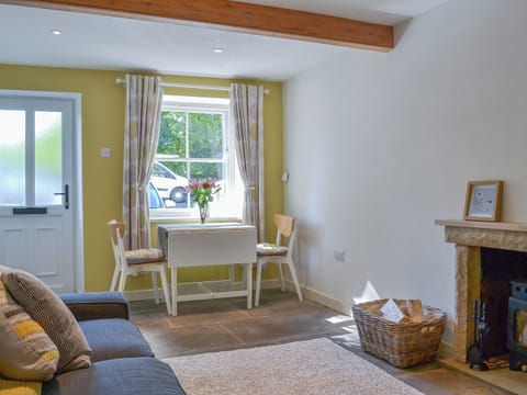 Beamed living area with woodburner | Clarence Cottage, Appleby-in-Westmorland