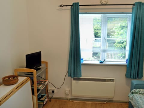 Cosy living area with double futon bed | The Pocket Watch, Seatown