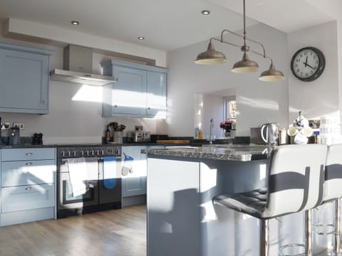 Fully fitted contemporary kitchen area with breakfast bar | Pear Tree Cottage and The Granary, East Witton, near Leyburn