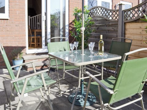 Paved patio with outdoor furniture | Signals Court, Scarborough