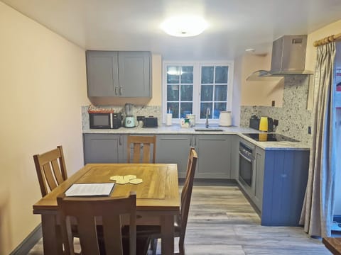 Well equipped kitchen/ dining area | Snowdon - The Woollen Mill, Penygroes, near Caernarfon