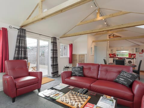 Comfortable lounge area with wood burner and Freeview TV | Swallows&rsquo; Nest, Wool, near Wareham