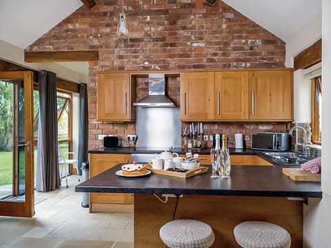 Well equipped kitchen with breakfast bar | Blackberry Barn - Middle Huntingford Barns, Charfield, near Wotton-under-Edge