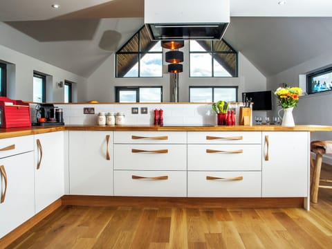 Modern kitchen integral to the open-plan design | Strathspey Lodge, Duthil, Carrbridge, near Aviemore