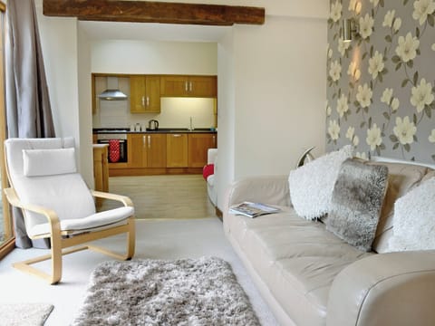 Homely living room with French doors to patio | Blackthorn Cottage, Swan Pool, near Falmouth