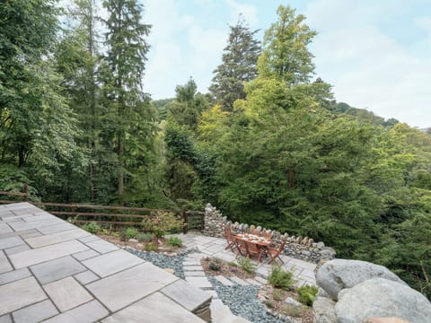 Sloping garden with views of the surrounding countryside | Waterfall Wood Cottage, Glenridding, by Ullswater