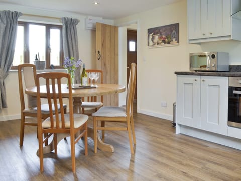 Convenient dining area within kitchen | The Lodge, Wedmore, near Cheddar