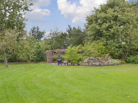 Garden with seating area | The Stable - Martin Lane Farm Cottages, Burscough, near Southport