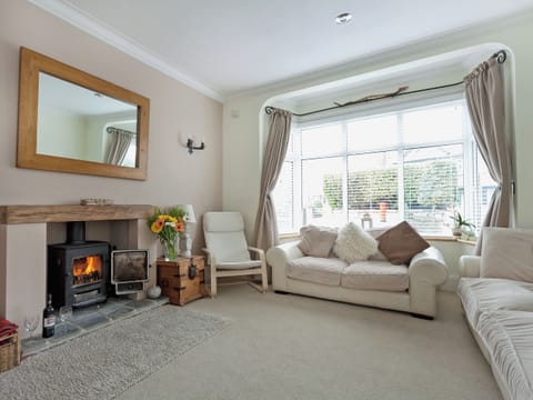 Beautifully designed living room with woodburner | Stourcliffe House, Bournemouth