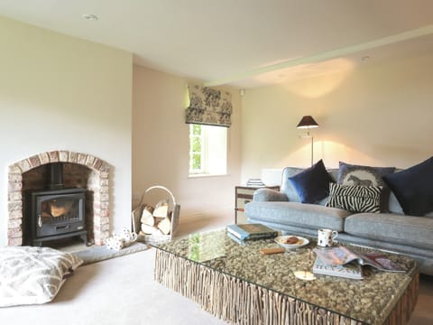 Cosy living room with wood burner | Garden Cottage, Settrington, near Malton