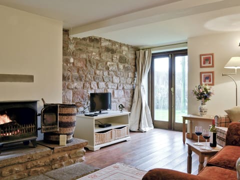 Cosy lounge with wood-burner and patio doors | Bramble Cottage - Bramble Cottage and Honey Cottage, Newland, near Coleford