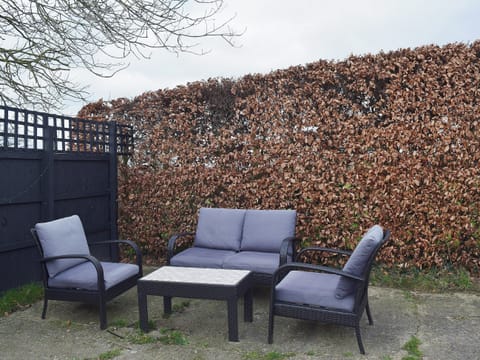 The additional seating on the patio makes an ideal space to relax with a good book | Blueberry Cottage, Debenham, near Framlingham