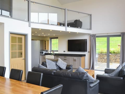 Stylish open plan living space with wood burner and 65&rdquo; Freeview TV | Heartwell Cottage - Bowlees Holiday Cottages, Wolsingham, near Stanhope