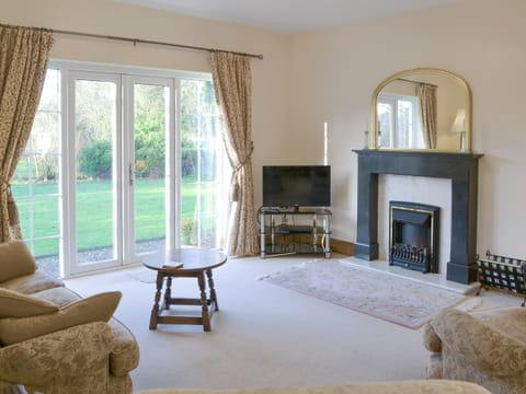 Spacious living area with French doors to garden | Alby Bungalow, Cumwhinton, Carlisle
