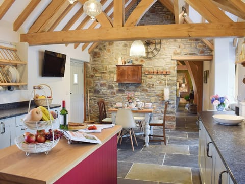 Spacious slate-floored kitchen and dining area | Soar Cottage, Dihewyd, near Aberaeron