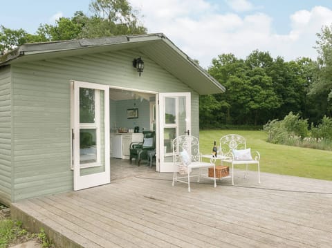 Sit out on the decking and enjoy a glass of wine | Yokefleet Cottage, Sandholme, near Beverley