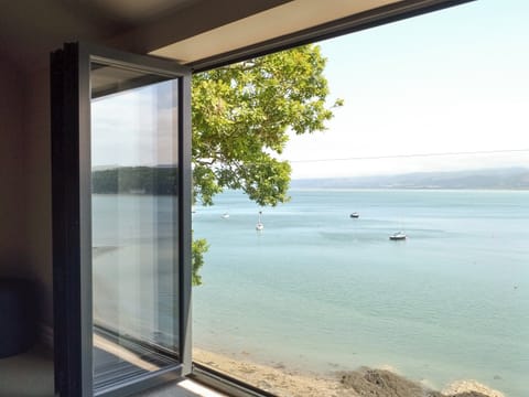 Wonderful views from the double bedroom seating area | Tan Y Fford, Glyngarth, near Beaumaris