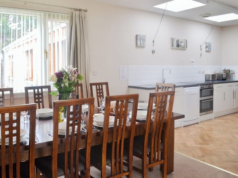Dining area with wonderful vire of the garden | Loramore, Aviemore