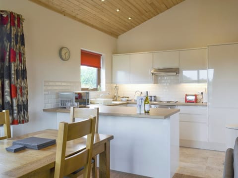 Spacious dining area and well-equipped kitchen | Hazel Lodge - Faulkers Lakes, Burgh le Marsh, near Skegness