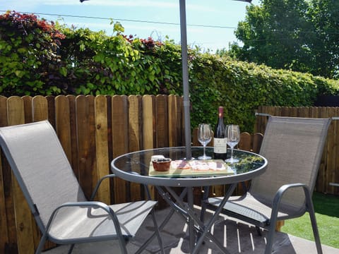 Well-kept garden with patio furniture and barbecue | Little Cottage, Wigtown