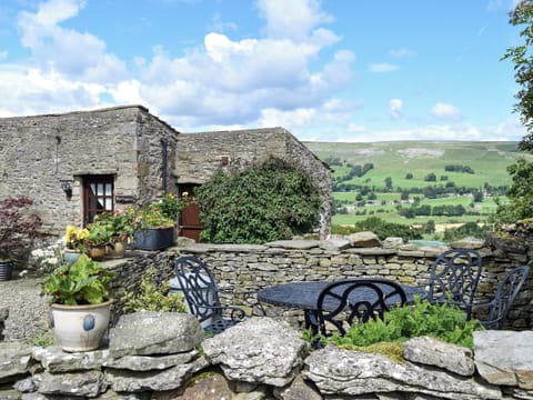 Enclosed garden boasting wonderful views | The Old Goat House, Thornton Rust, near Leyburn