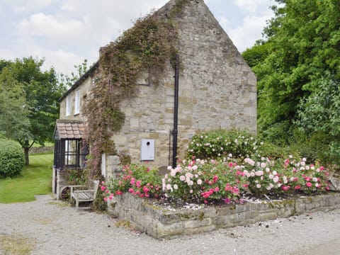 Traditional stone-built property with mature garden and lawned area | Mill Cottage - Rievaulx Cottages, Rievaulx, near Helmsley