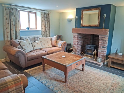 Cosy living room with wood burner | Swallow Barn, Torpenhow, near Wigton