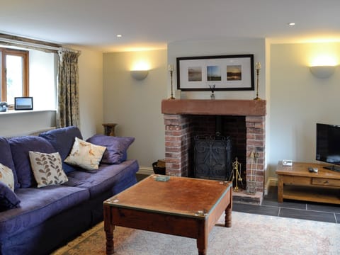 Cosy living room with wood burner | Swallow Barn, Torpenhow, near Wigton