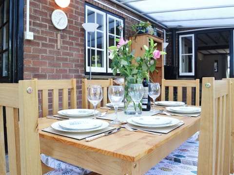 The conservatory makes a great alternative dining room | Pam’s Plaice, Offord D’Arcy, near Godmanchester