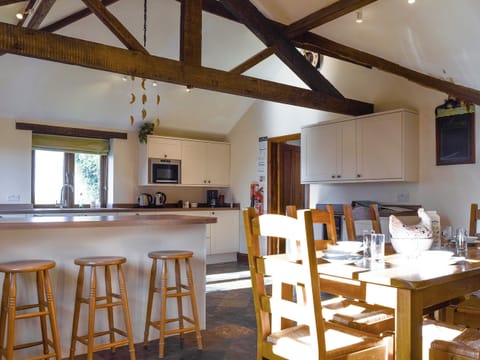 Large kitchen/diner with exposed wooden beams | Swallow Barn, Warkworth, Banbury