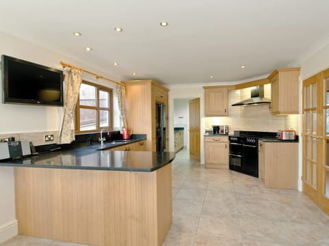 Large well equipped farmhouse style kitchen | Magnolia Cottage, Aberaeron