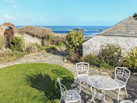 Garden seating area with stunning sea views | Manor House, West Pentire