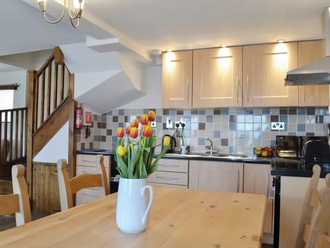 Traditional farmhouse style kitchen/dining area | Bryntrisant, Devil’s Bridge, near Aberystwyth
