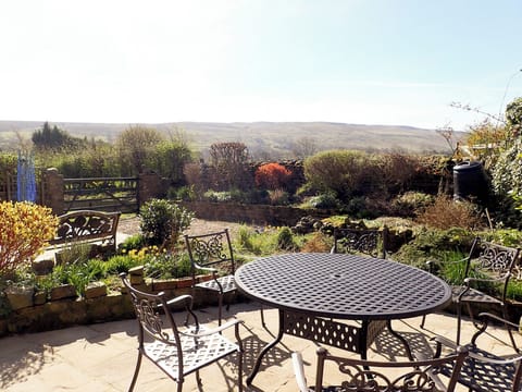 Well-maintained garden with terraced patios and outdoor furniture | The Old Chapel, Thoralby, near Leyburn