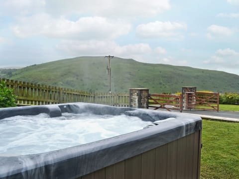 Relaxing hot tub with far reaching views | Eithinog - Tynrhelyg Cottages, Talybont, near Aberystwyth